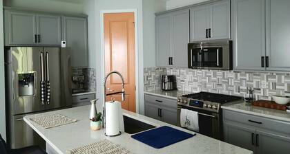 Family home in Beachwalk with roomy common areas and private spaces for a group.