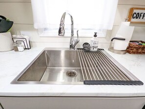 Fridge, microwave, oven, stovetop - Remodeled Comfort Home Bettendorf + Fenced yard (Bettendorf)