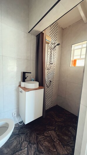 Shower, hair dryer, towels, soap