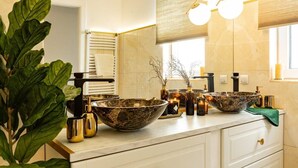 A bathroom with two large bowls, a mirror, a plant, and a window. - Qult·co - The Renaissance Affair (București)