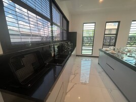 Luxury Villa | Private kitchen | Full-size fridge, microwave, stovetop, electric kettle