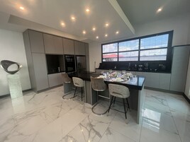 Luxury Villa | Private kitchen | Full-size fridge, microwave, stovetop, electric kettle