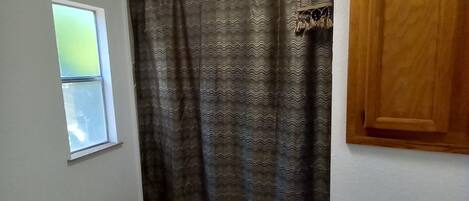 Shower, towels, soap, toilet paper