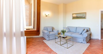 Suite, City View | Living area | Flat-screen TV