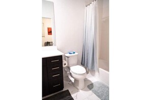 Shower, hair dryer, towels, soap