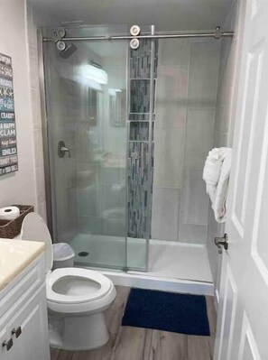 Shower, hair dryer, towels, soap