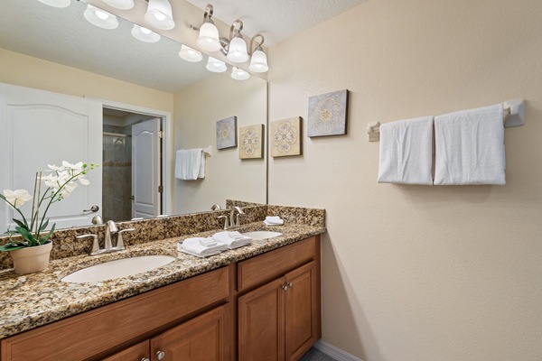 Our functional bathroom features two sinks and soft towels