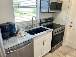 Coffee/tea maker, fridge, microwave, oven