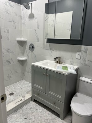 Shower, towels, soap, toilet paper