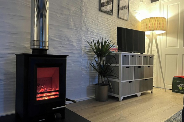 Log burning stove, drawers and lamp