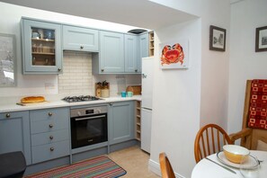 Fridge, microwave, toaster, cookware/dishes/utensils