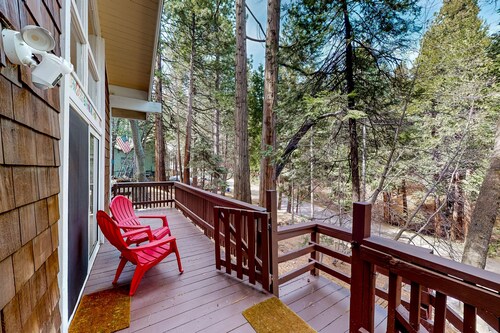 Dog-friendly cabin surrounded by trees and wildlife with fireplace & deck