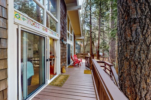 Dog-friendly cabin surrounded by trees and wildlife with fireplace & deck