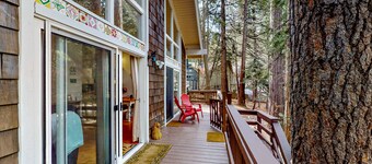 Dog-friendly cabin surrounded by trees and wildlife with fireplace & deck
