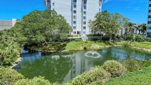 A modern building with a water feature in front.