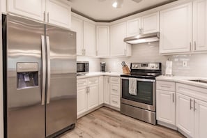Coffee/tea maker, fridge, microwave, oven