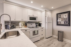 Coffee/tea maker, fridge, microwave, oven