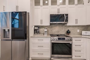 Coffee/tea maker, fridge, microwave, oven
