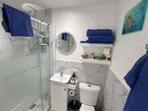 Shower, hair dryer, towels, soap