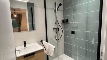 Shower, hair dryer, towels, soap