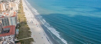 New Listing! Ground Floor, Elegant 2 Bedroom Condo minutes from the beach.