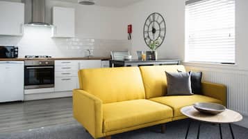 Comfort Apartment | Living area | 32-inch LED TV with cable channels, Netflix, streaming services