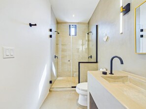 Shower, hair dryer, towels, shampoo