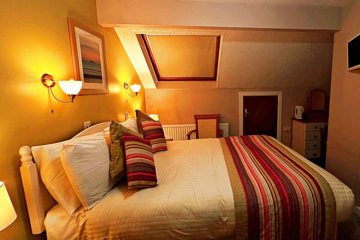 Economy kamer, 1 twee- of 2 eenpersoonsbedden, uitzicht op tuin | Gratis wifi