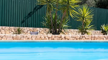 Seasonal outdoor pool, pool loungers