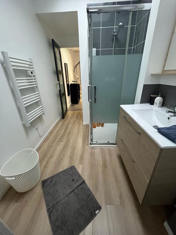 Shower, hair dryer, towels, soap