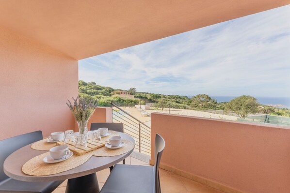 Enjoy a romantic meal on the balcony with a view of the scenic landscape.
