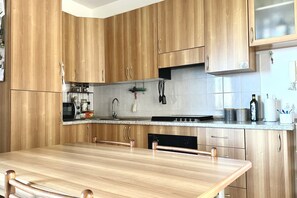 Fridge, oven, dining tables