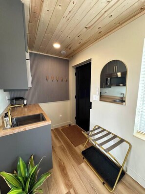 Fridge, microwave, coffee/tea maker, cookware/dishes/utensils - Nordic Harbor | Room 5 | Cedar Shadows (Center City)