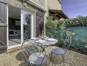 Enjoy a romantic dinner for two in this serene dining area, complete with a round table and comfortable seating.