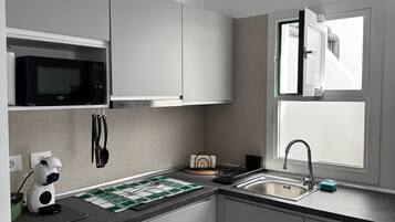 Fridge, microwave, stovetop, coffee/tea maker