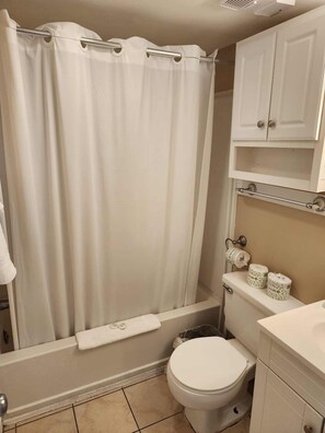 Shower, hair dryer, towels, shampoo