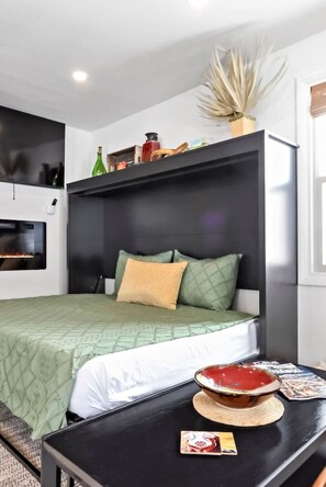 1 bedroom, desk, iron/ironing board, travel crib