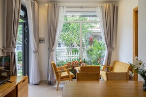 Basic Apartment, Multiple Beds | Living area | Flat-screen TV - Do Gia Bao Villa (Da Lat)