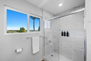 Shower, hair dryer, towels, soap