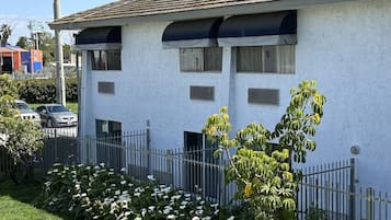 A two-story building with a sign reading "Garden Grove INN".