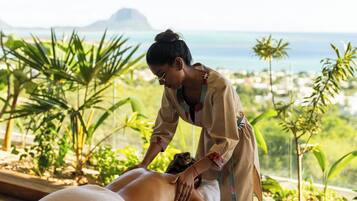 Experience a rejuvenating massage amidst lush greenery and breathtaking ocean views.