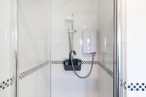 Shower, hair dryer, towels, shampoo