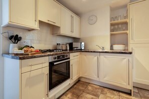 Fridge, oven, toaster, cookware/dishes/utensils