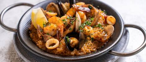 A seafood dish in a bowl with a textured exterior.