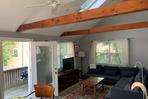 Living room with door to the long balcony deck on the left