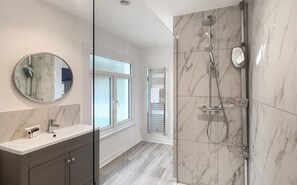 Shower, hair dryer, towels, shampoo