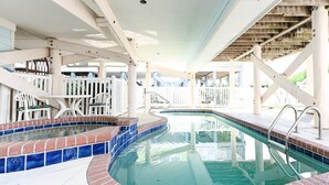 A pool area with two hot tubs and a seating area with chairs and a table. - Oceanfront 4 BR Beach House with a Private Pool! Surfin' Turf (Surfside Beach)