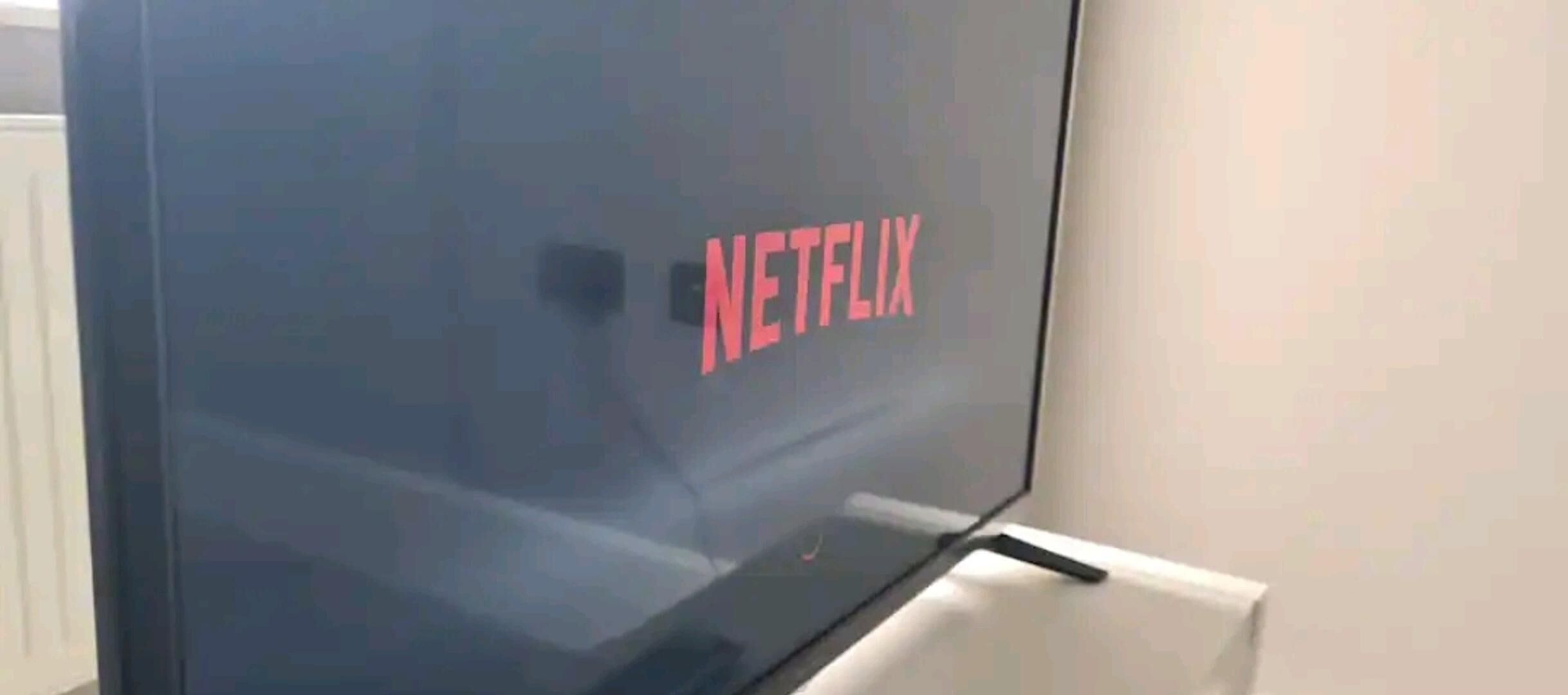A television with the Netflix logo on the screen.