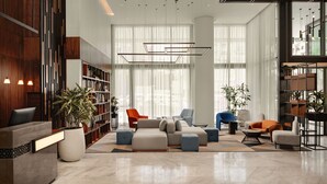 A modern lobby with a reception desk, seating area, and large windows. - Courtyard by Marriott Casablanca Downtown (Casablanca)