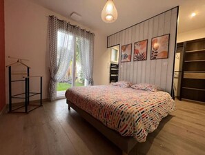 Cozy retreat with a large bed and a stylish wardrobe.